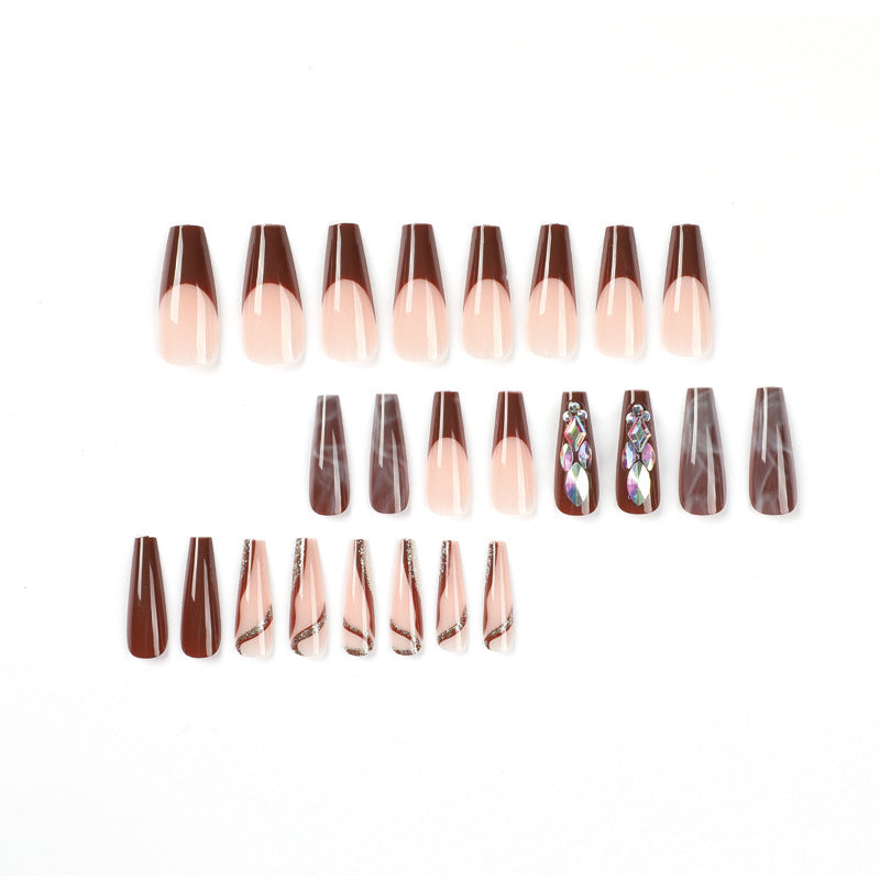 Artificial nail extensions with elegant gemstone embellishments Stornfield