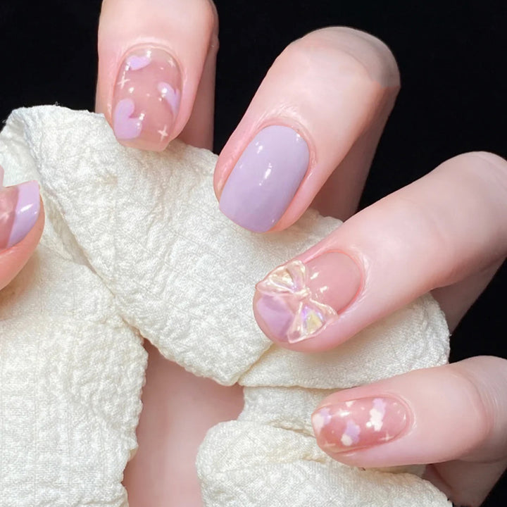 Artful nail extensions with an elegant leaf pattern Stornfield