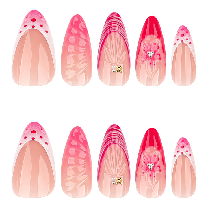 Artful stiletto nails with floral design and glitter accents Stornfield