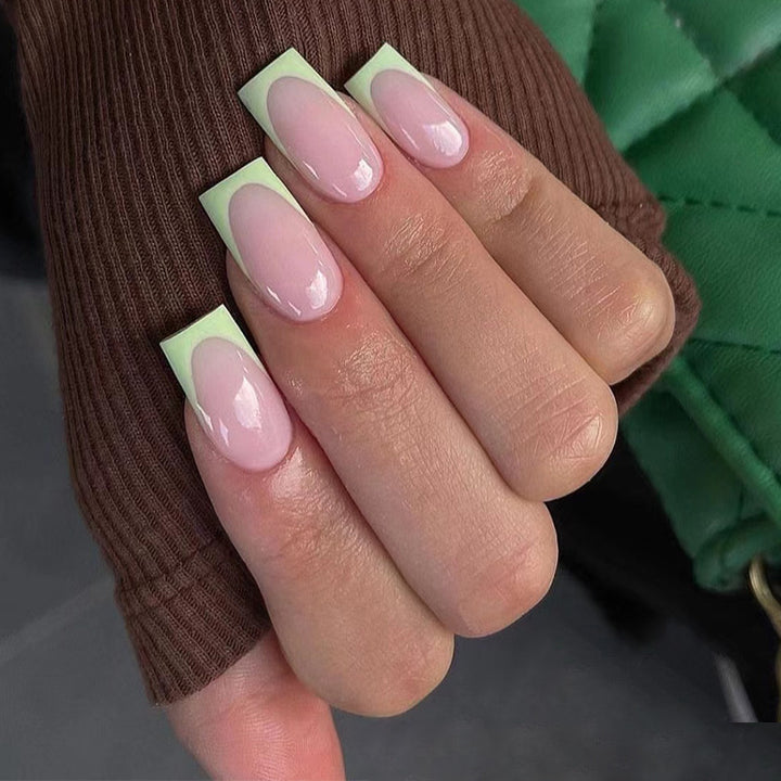 Artistic nail extensions with elegant French tip and modern accents Stornfield