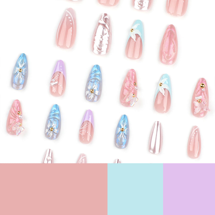 Artistic stiletto nails with delicate flower and glitter embellishments Stornfield