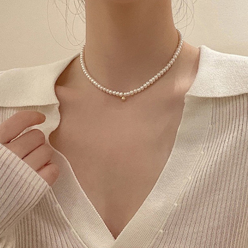 Delicate pearl necklace with elegant gold accent chain Stornfield