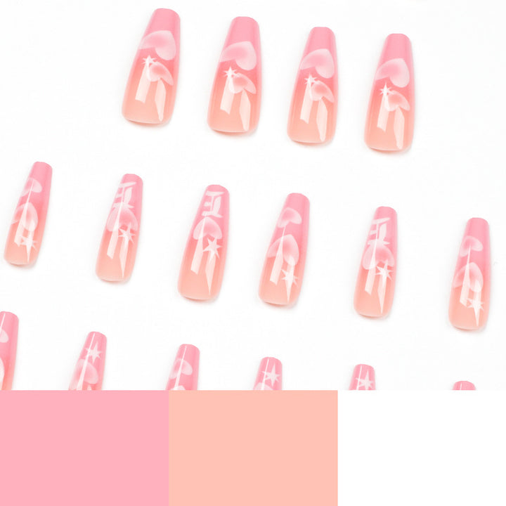 Artificial nail art with heart patterns Stornfield