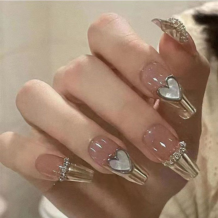 Artificial nails with heart and glitter accents Stornfield
