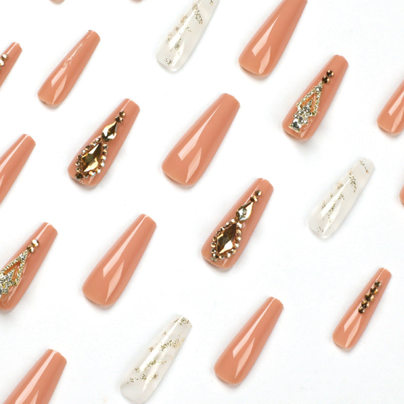 Artful nail extensions with glitter embellishments and delicate accents Stornfield