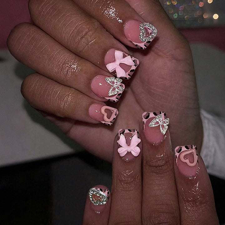 Artificial nail art with embellishments Stornfield