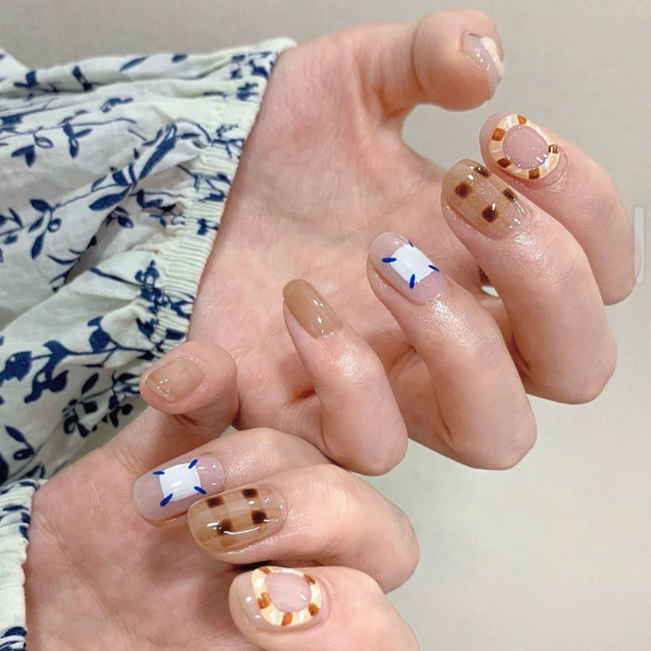Playful artificial nails with cute animal and pattern accents Stornfield