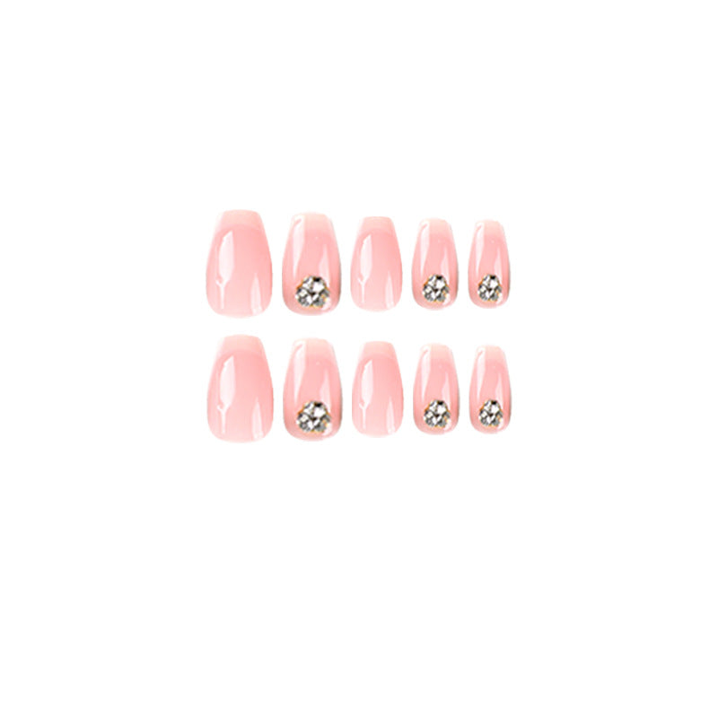 Artful nail extensions with elegant French tip and rhinestone embellishments Stornfield