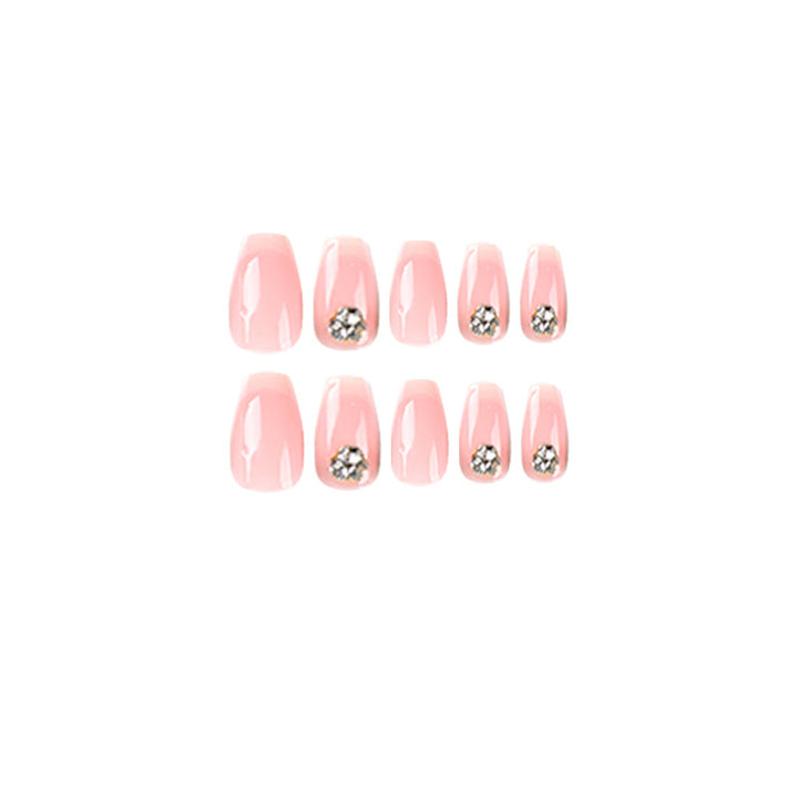 Artful nail extensions with elegant French tip and rhinestone embellishments Stornfield
