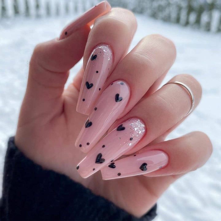 Artistic stiletto nails with heart design Stornfield