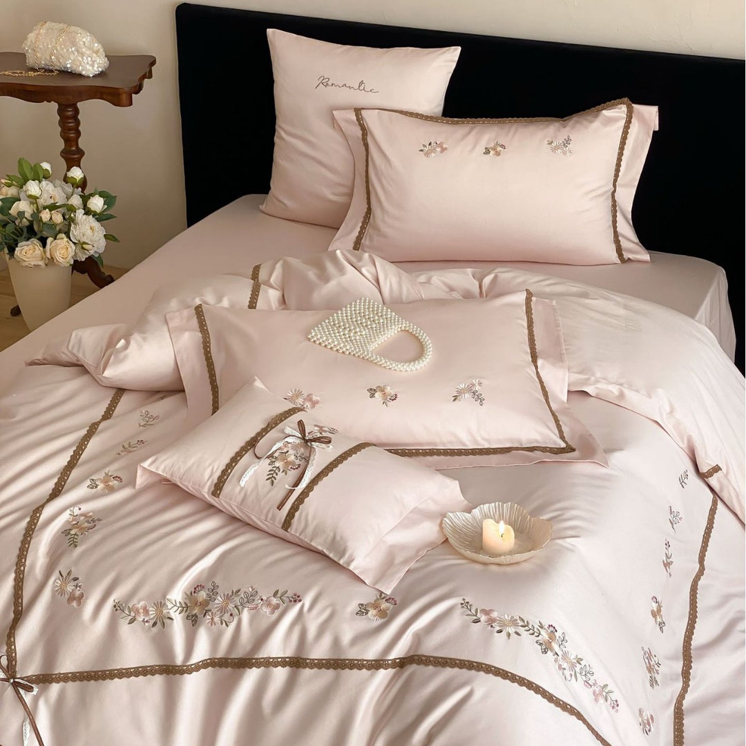 Embroidered bed linen set made of cotton satin with lace trim and floral appliqués