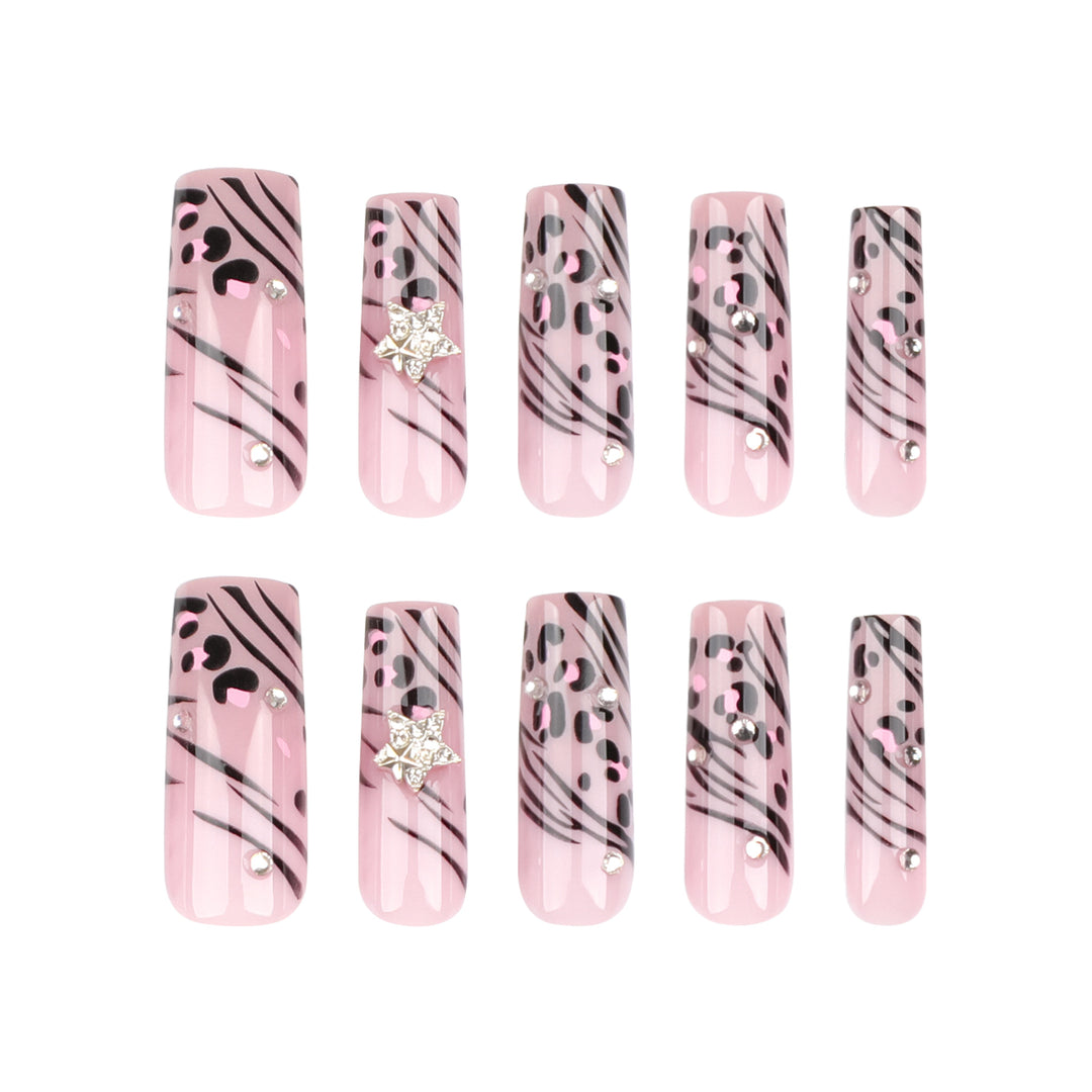 Artful Nail Art with Zebra Pattern and Glitter Accents Stornfield