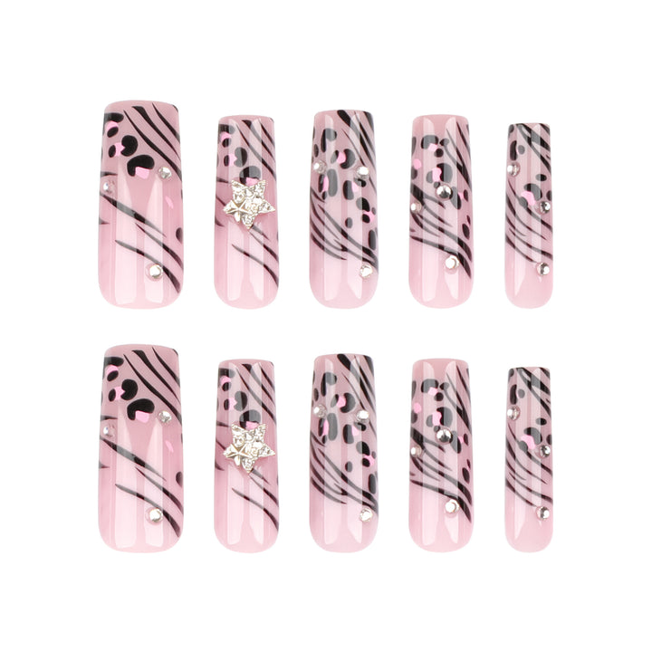 Artful Nail Art with Zebra Pattern and Glitter Accents Stornfield