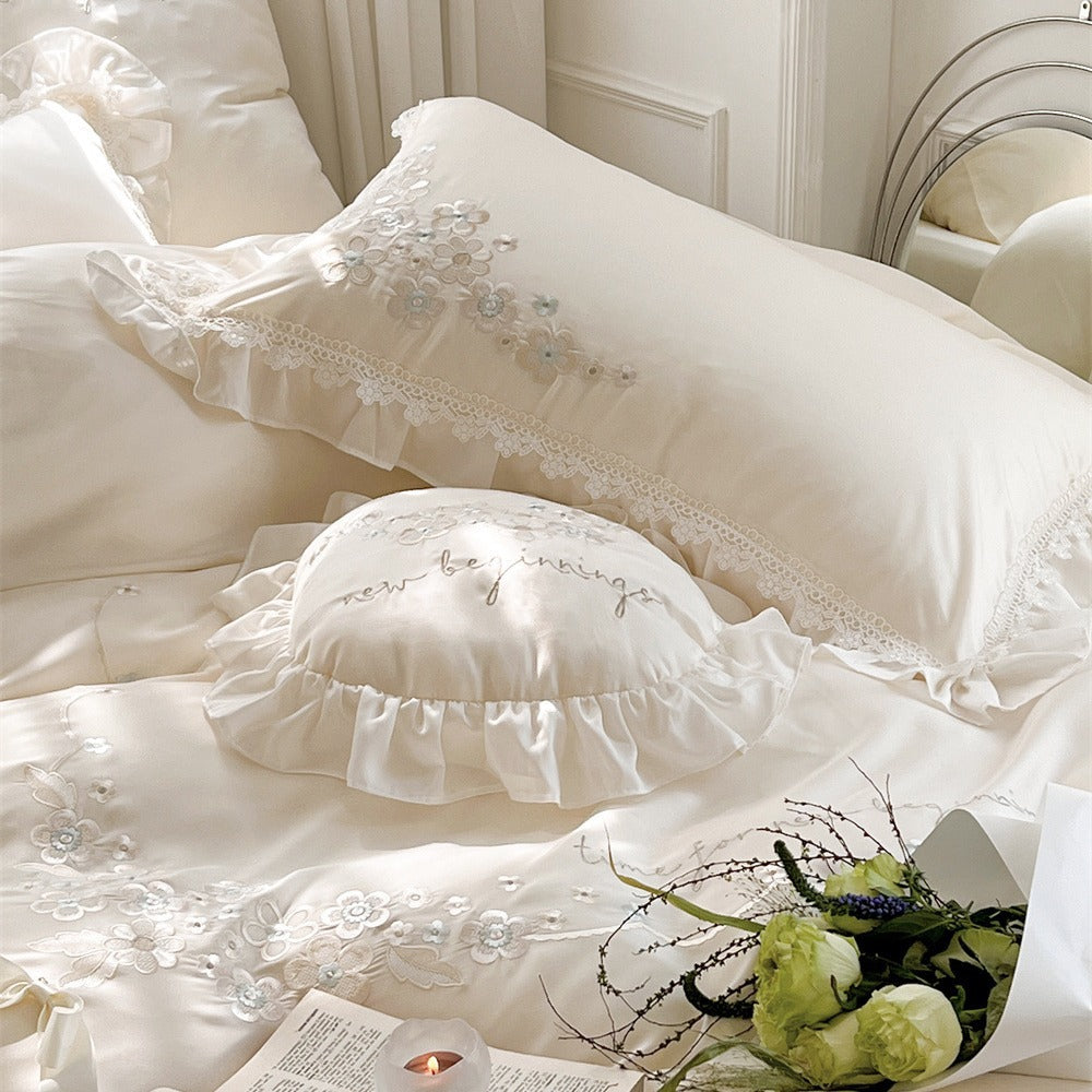 Victorian-inspired cotton satin bedding set with lace ruffles and bows