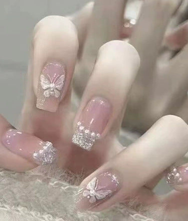 Elegant nail design with pearl embellishment Stornfield
