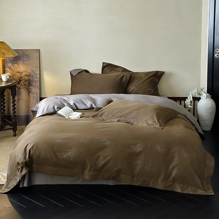 Elegant finely woven bedding set made of Mako satin with subtle butterfly jacquard structure and reversible pillowcase