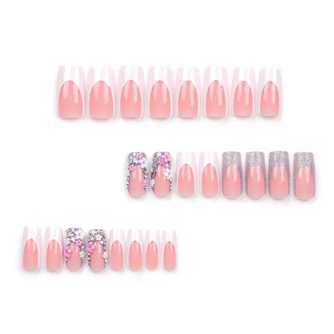 Artificial nail set with elegant 3D flowers and glitter embellishments Stornfield