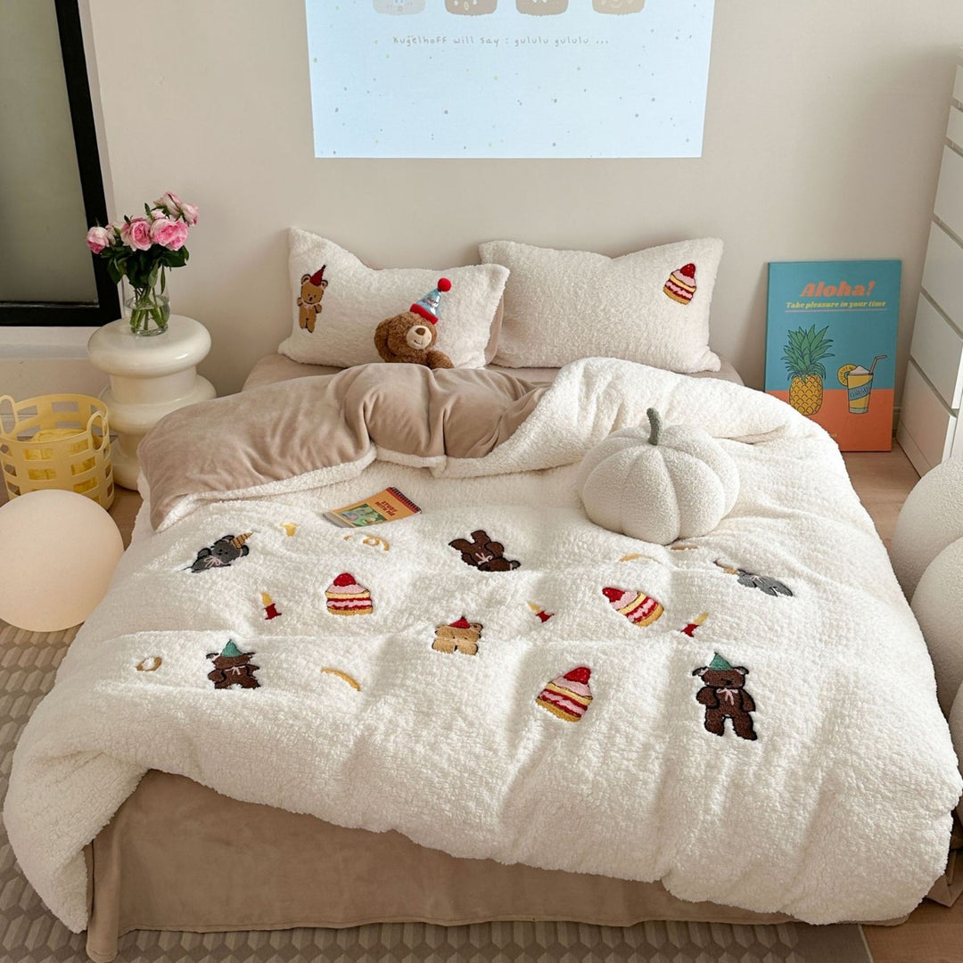 Cozy Sherpa blanket with embroidered teddy and cake motifs