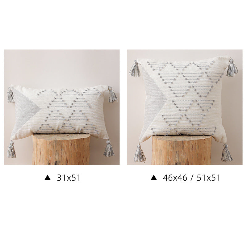 Decorative woven cushion cover with geometric tuft-relief and tassels Stornfield