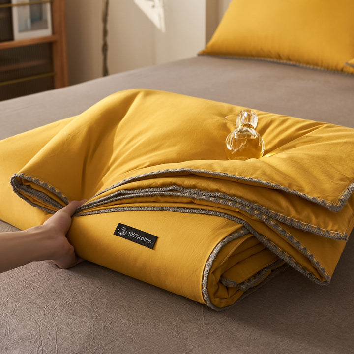 All-season quilted comforter made of pure cotton with a fine trim