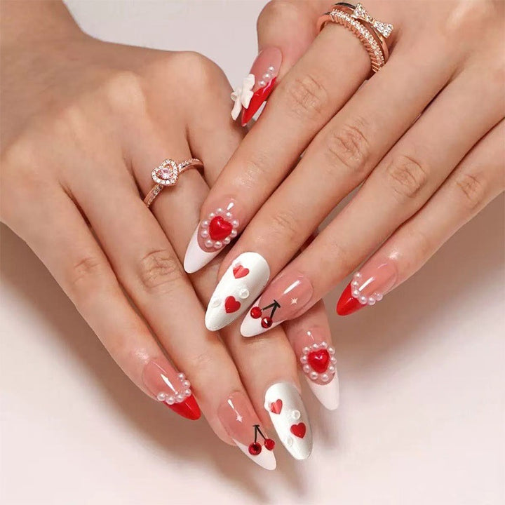 Creative nail art with heart and cherry motifs Stornfield