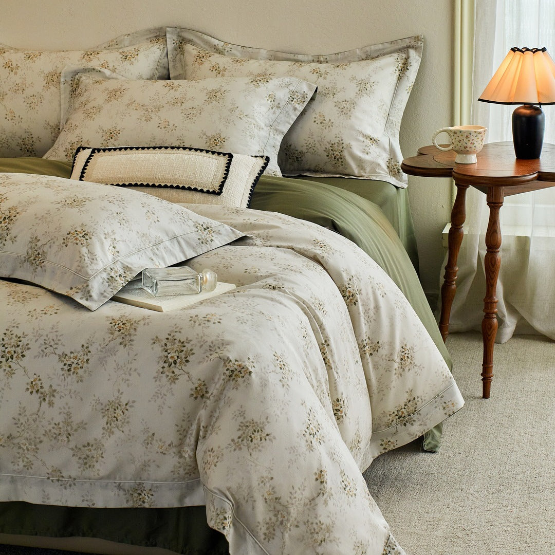Luxurious cotton satin bed linen set with millefleurs floral pattern and fine piping