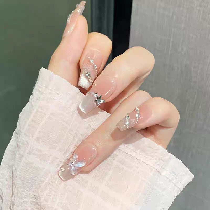 Artificial nails with glamorous decorations and shine Stornfield