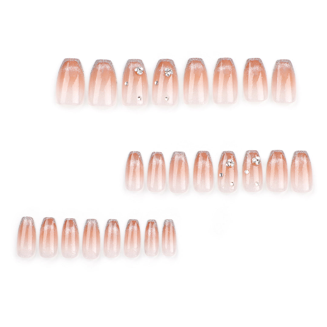 Glamorous artificial nails with glitter and rhinestone accents Stornfield