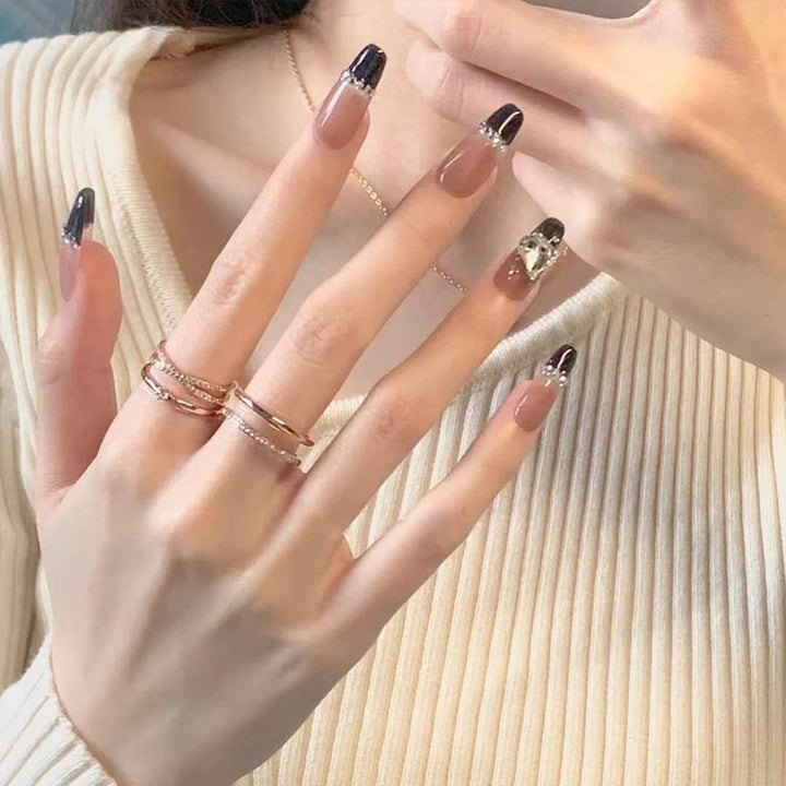 Glamorous artificial nails with heart and glitter details Stornfield