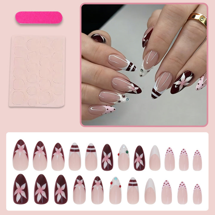 Artificial nail set with floral design and glitter accents Stornfield
