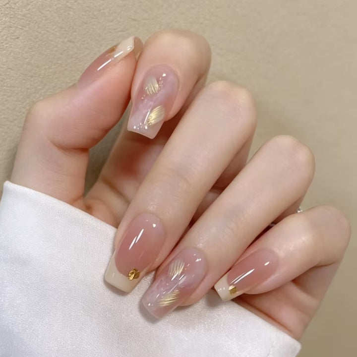 Elegant French Tip Nail Extensions with Gold Accents