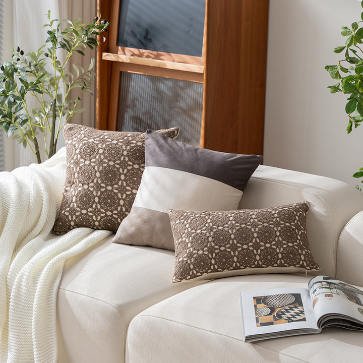 Square decorative cushion with crocheted ornament overlay and linen texture