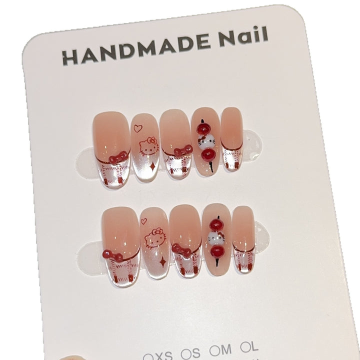 Artificial nails with playful Hello Kitty design Stornfield