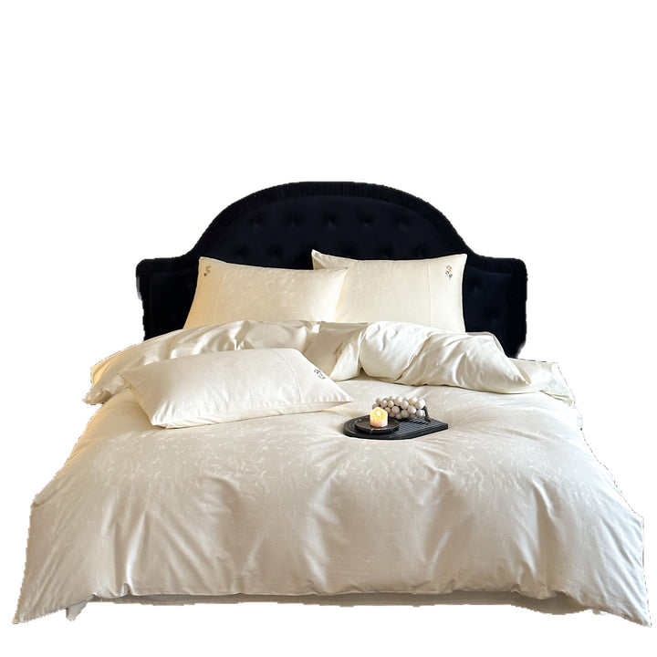 High-gloss satin bedding set with subtle floral jacquard and breathable comfort lining