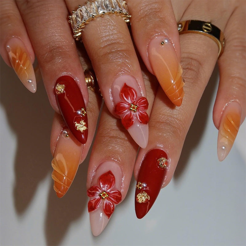 Acrylic nail set with elegant floral accents and glitter details Stornfield