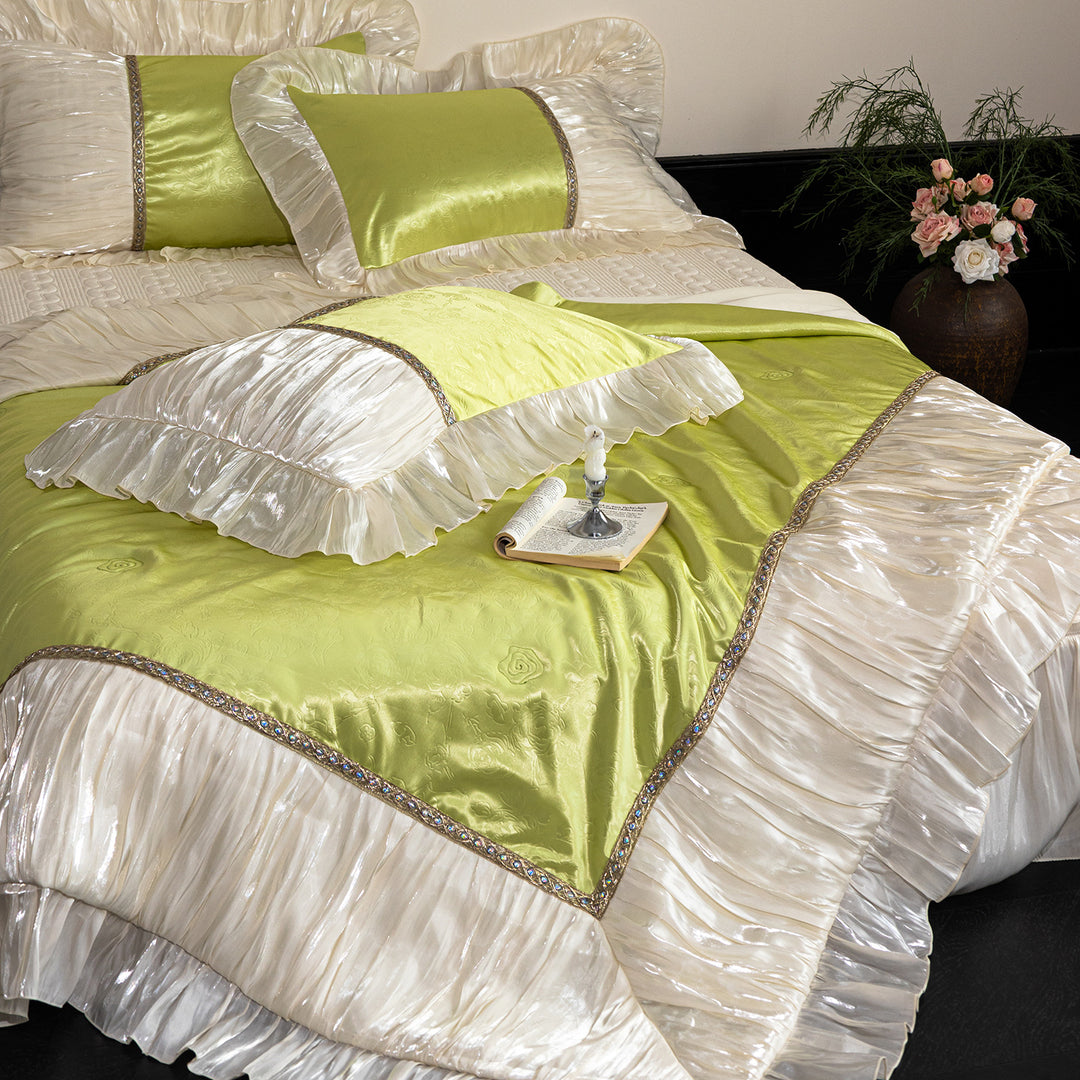 Opulent ruffled bedspread and pillow set made of satin with decorative border
