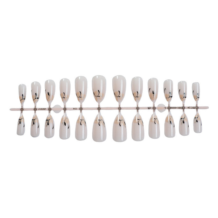 Creative nail art set with fine black and white decorations Stornfield
