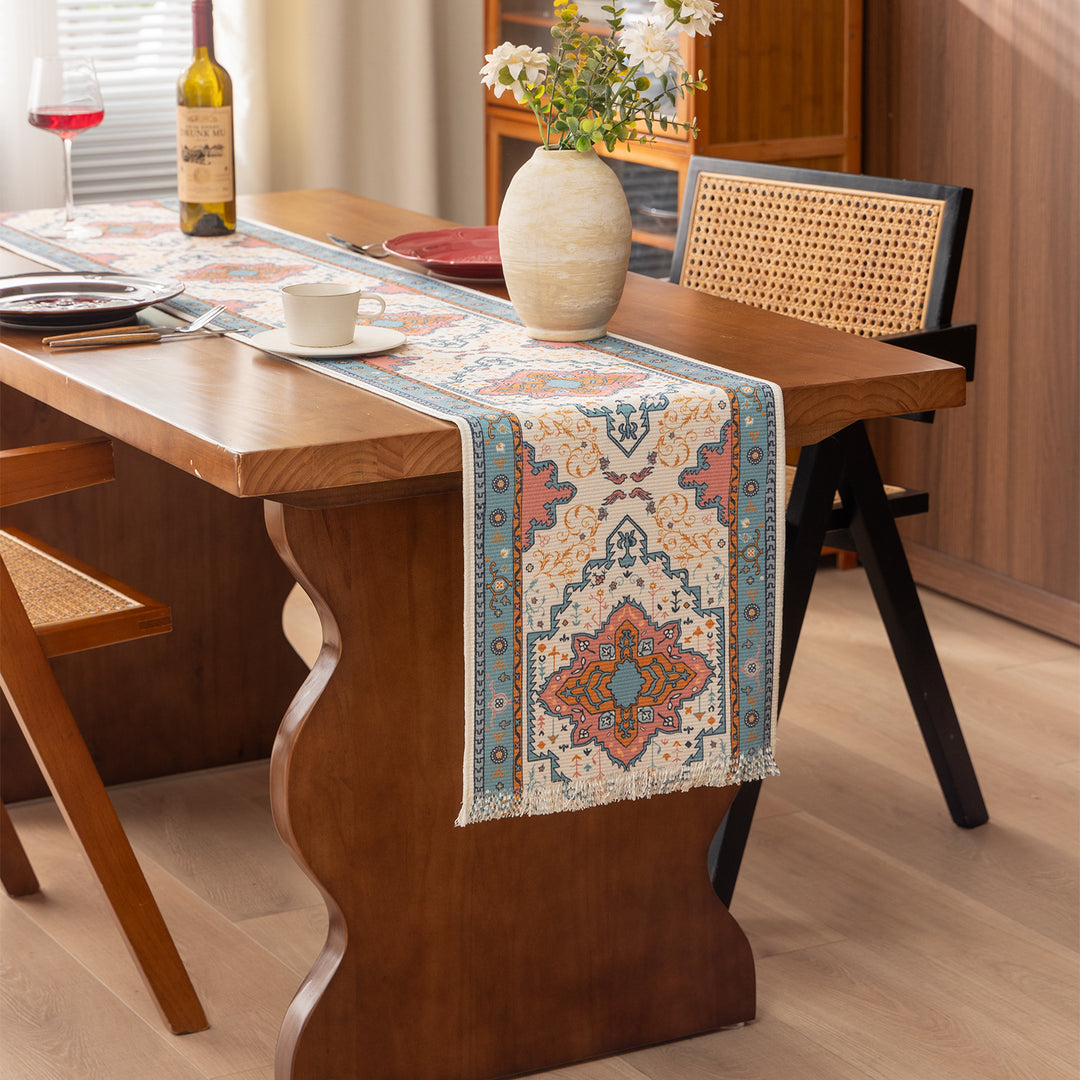 Woven table runner made of cotton blend with oriental medallion pattern and fringes Stornfield