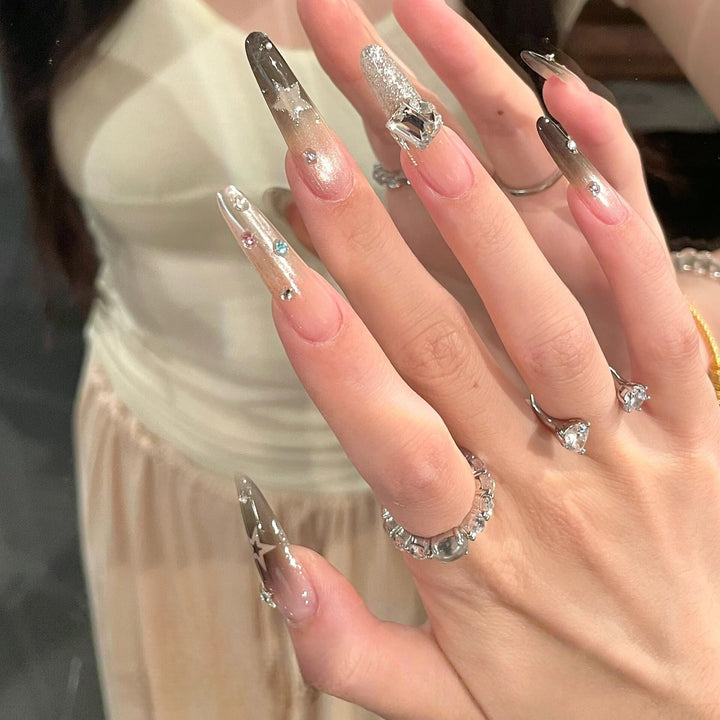 Glamorous artificial nails with sparkling rhinestone and star designs Stornfield