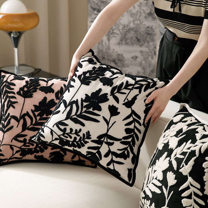Square decorative pillow with floral flock embroidery and fine piping edge