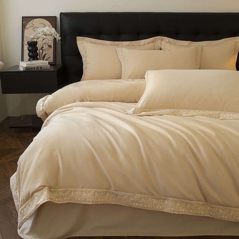 Luxurious embroidered bedding set in cotton satin with decorative trim
