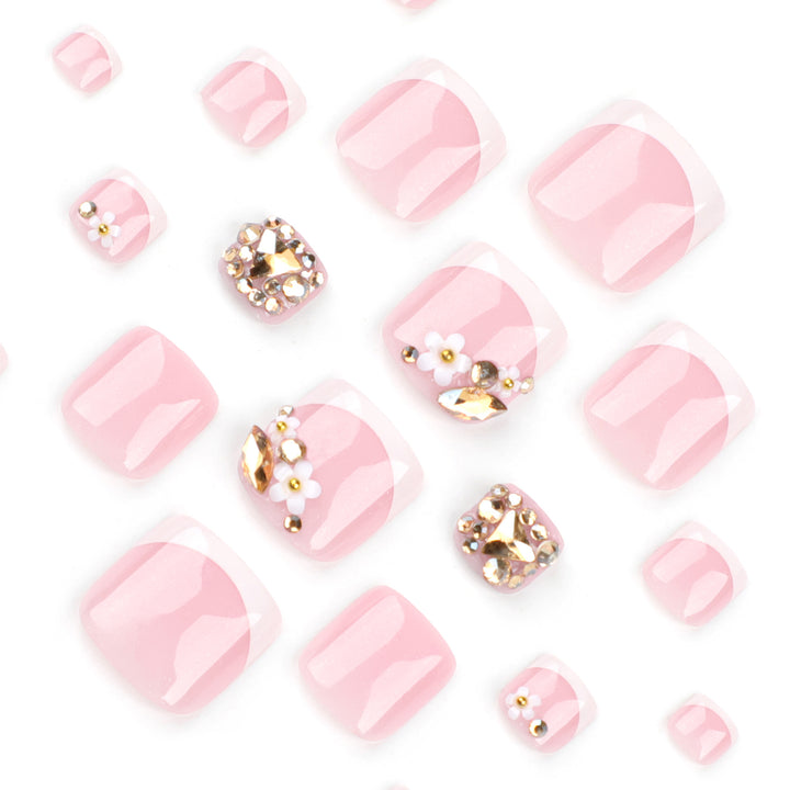 Artistic toenail art with elegant flower and glitter accents Stornfield