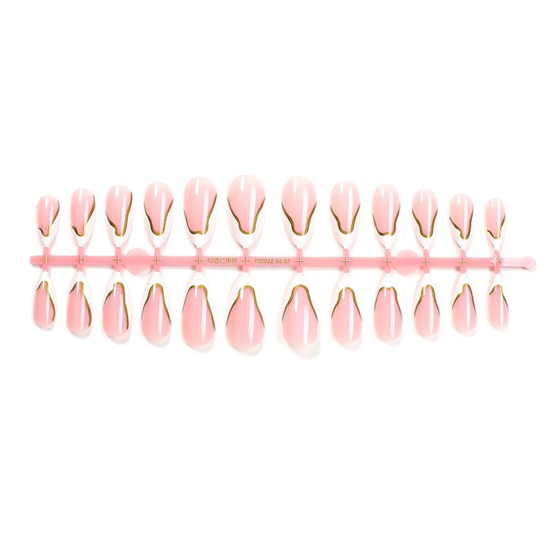 Artifical nail set with elegant gold trim and delicate pink Stornfield
