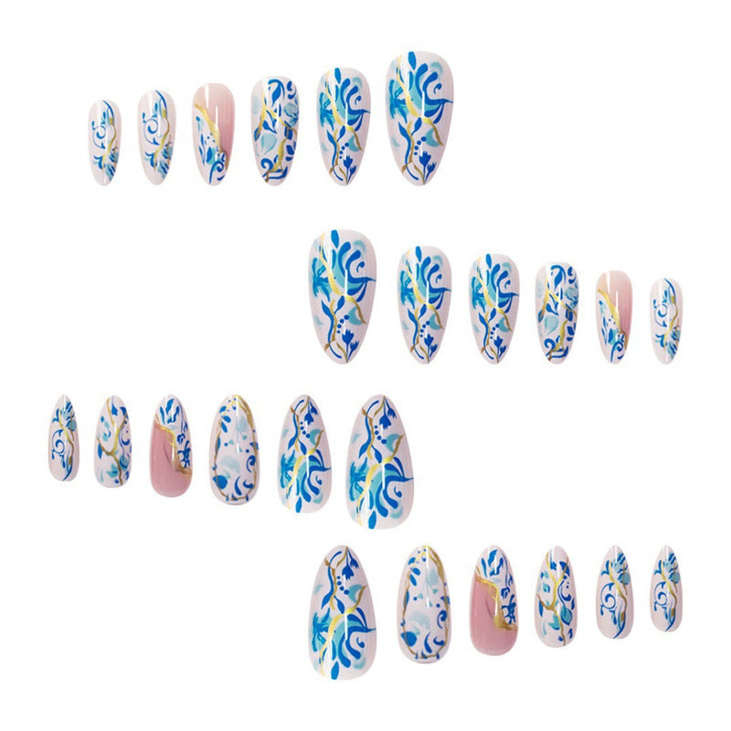 Artistic Floral Press-On Nail Design with Gold Accents Stornfield