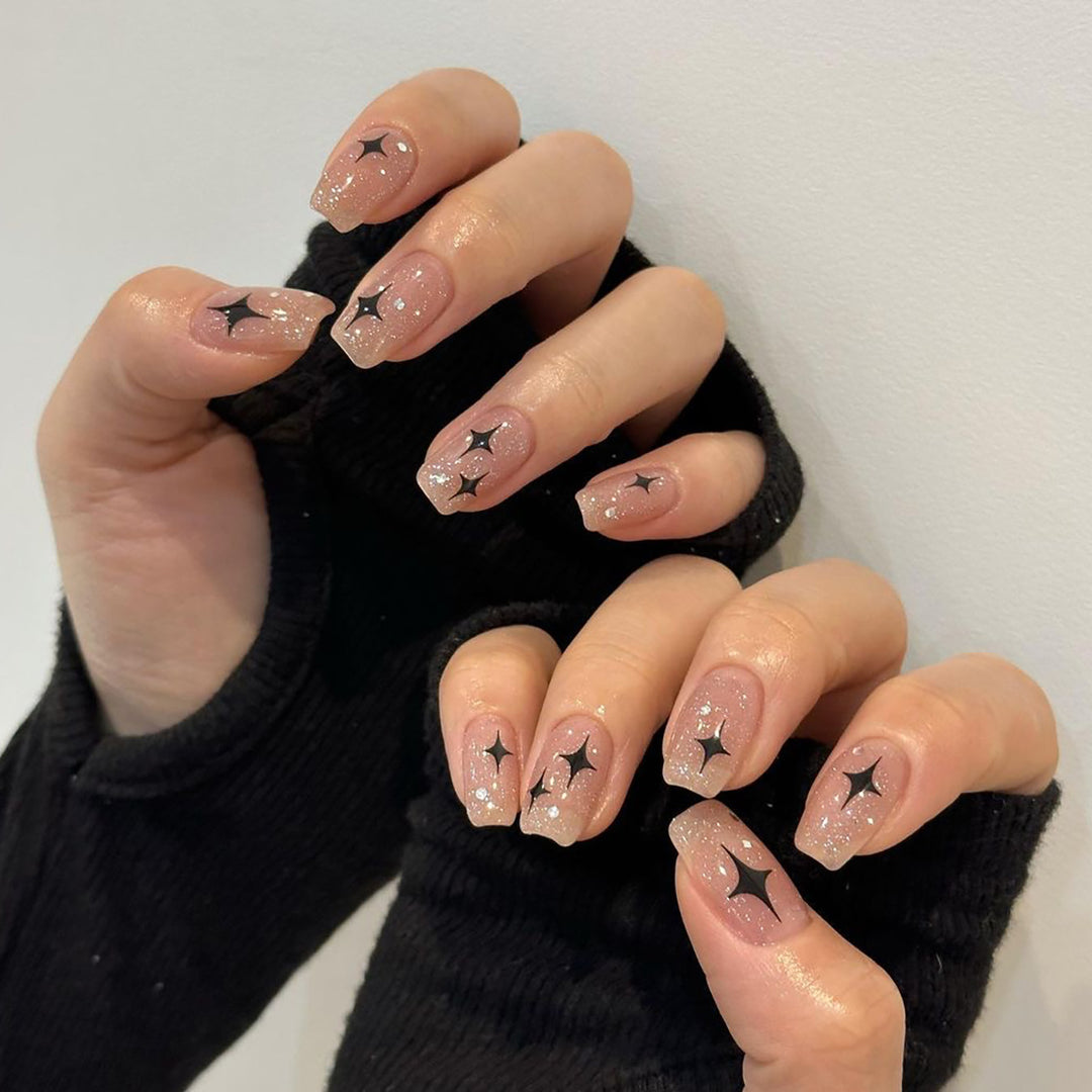 Artful Nail Extensions with Glitter and Star Pattern Stornfield