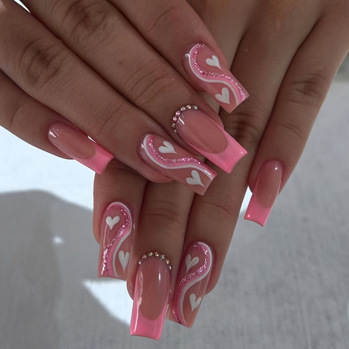 Artificial nail set with romantic heart designs and glamorous accents Stornfield