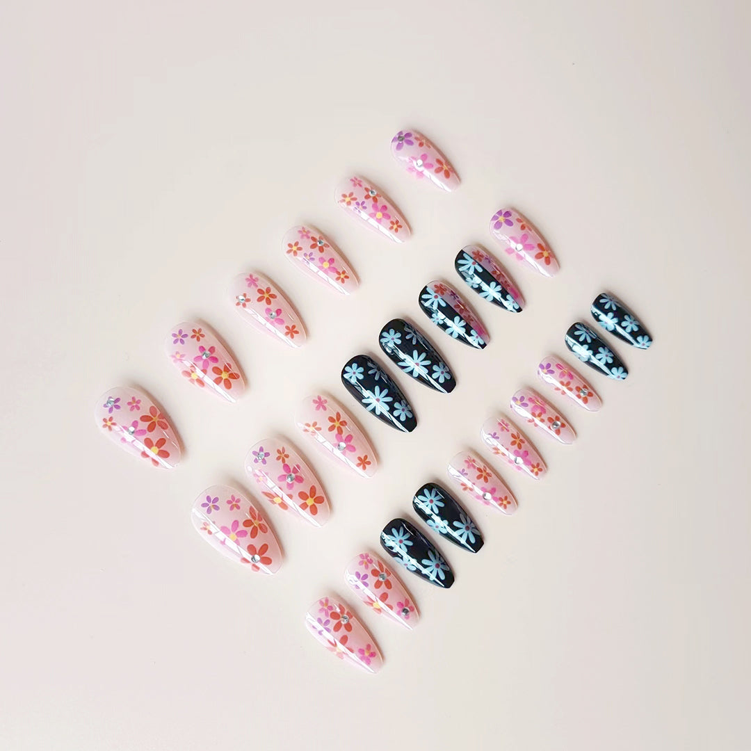 Artificial nail set with floral 3D embellishments and glitter accents Stornfield