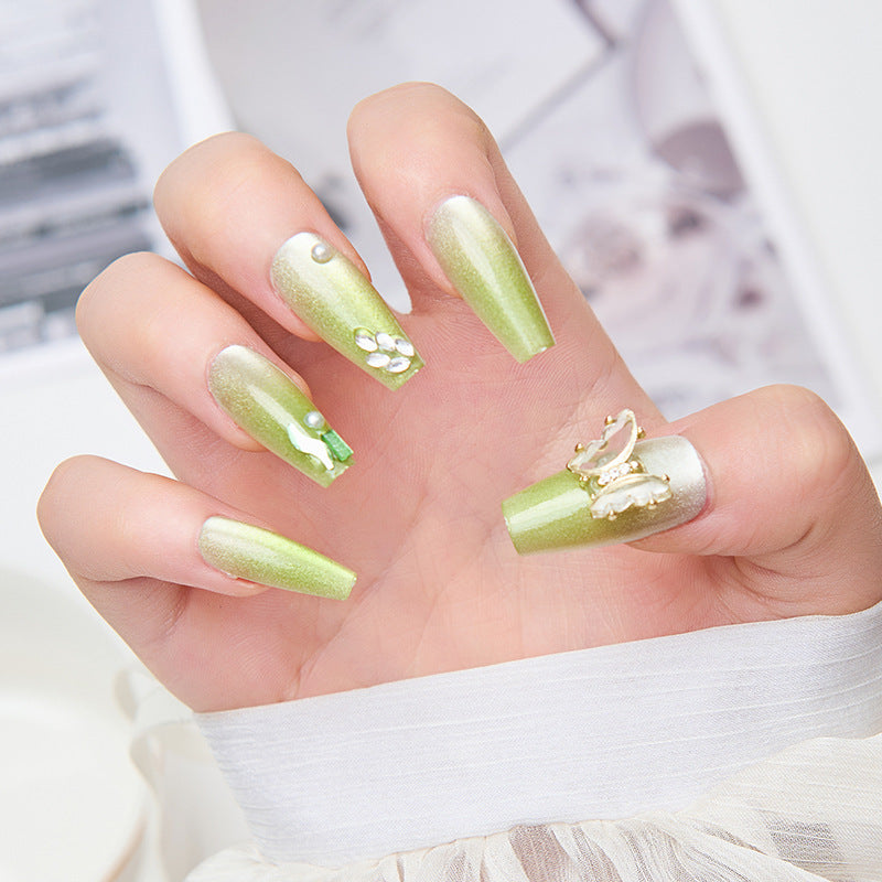 Artificial nails with butterfly accents and glitter details Stornfield