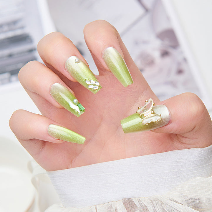 Artificial nails with butterfly accents and glitter details Stornfield