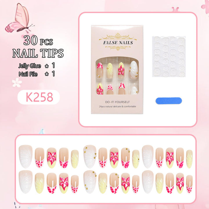 Artificial nail set with floral motifs and elegant embellishments Stornfield